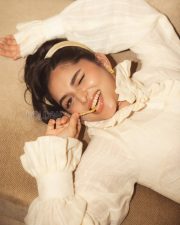 Graceful Actress Kayadu Lohar in a White Ruffled Blouse and Cream Wide Leg Pants Photos 02