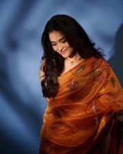 Heroine Kayadu Lohar in a Transparent Mustard Floral Saree with a Black Sleeveless Blouse Photos 01