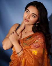 Heroine Kayadu Lohar in a Transparent Mustard Floral Saree with a Black Sleeveless Blouse Photos 03