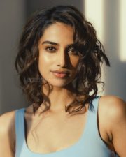 Hot Sensation Meenakshi Chaudhary in a Light Blue Tank Top and Jeans Photos 04