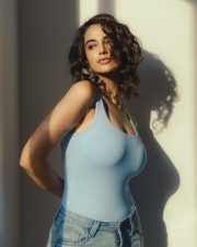 Hot Sensation Meenakshi Chaudhary in a Light Blue Tank Top and Jeans Photos 08