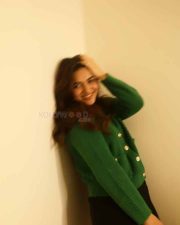 Idhayam Murali Actress Kayadu Lohar in a Dark Green Ribbed Cardigan with a Black Mini Skirt Photos 01