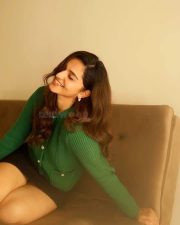 Idhayam Murali Actress Kayadu Lohar in a Dark Green Ribbed Cardigan with a Black Mini Skirt Photos 04