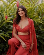 Indian Actress Aahana Kumra in a Red Bralette Style Top with a Wide Leg Pants Photos 02
