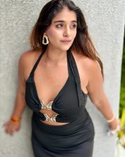 Indian Television Actress Chandni Bhagwanani in a Black Halter Neck Mini Dress with Cleavage Cutouts Photos 05