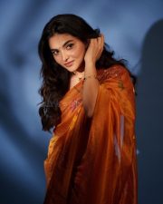 Radiant Actress Kayadu Lohar in a Orange Floral Printed Organza Saree Photos 01