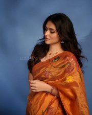 Radiant Actress Kayadu Lohar in a Orange Floral Printed Organza Saree Photos 03