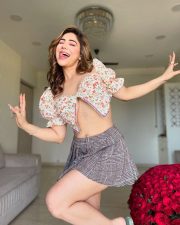 Sensual Kangna Sharma Topless in a Floral Crop Top and Pleated Mini Skirt Photos 01