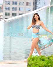Sizzling Aahana Kumra Legs in a Blue Printed Bikini With Floral Sarong Photos 05
