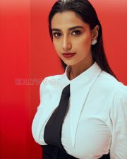 Striking Actress Meenakshi Chaudhary in a White puff shoulder blouse with black necktie waistcoat and wide leg trousers Photos 01 Striking Actress Meenakshi Chaudhary in a White puff shoulder blouse with black necktie waistcoat and wide leg trousers Photos 01