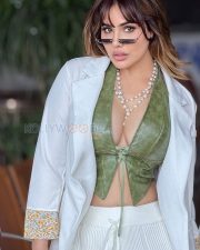 Striking Kangna Sharma Cleavage in a Olive Green Leather Deep V Lace Up Crop Top White Blazer White Ribbed Wide Leg Pants Photos 01