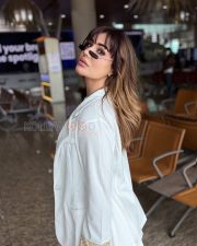 Striking Kangna Sharma Cleavage in a Olive Green Leather Deep V Lace Up Crop Top White Blazer White Ribbed Wide Leg Pants Photos 02