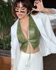 Striking Kangna Sharma Cleavage in a Olive Green Leather Deep V Lace Up Crop Top White Blazer White Ribbed Wide Leg Pants Photos 03