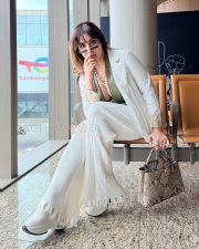 Striking Kangna Sharma Cleavage in a Olive Green Leather Deep V Lace Up Crop Top White Blazer White Ribbed Wide Leg Pants Photos 05