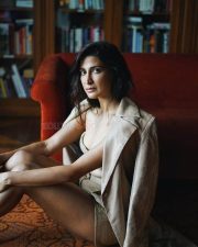 Stunning Cleavage in a Golden long Coat with a Bralette and Mini Skirt Photos 02