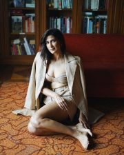 Stunning Cleavage in a Golden long Coat with a Bralette and Mini Skirt Photos 03