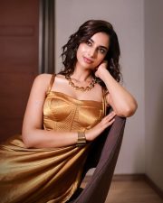 Stunning Glamour Beauty Meenakshi Chaudhary in a Golden Maxi Dress Photos 03