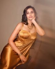 Stunning Glamour Beauty Meenakshi Chaudhary in a Golden Maxi Dress Photos 05