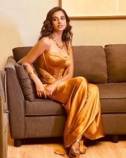Stunning Glamour Beauty Meenakshi Chaudhary in a Golden Maxi Dress Photos 06