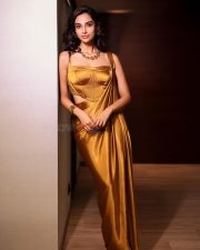 Stunning Glamour Beauty Meenakshi Chaudhary in a Golden Maxi Dress Photos 07