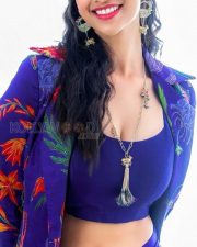 Stunning Meenakshi Chaudhary in a Vibrant Blue Bralette with Matching Skirt and a Stylish Shrug Photos 01