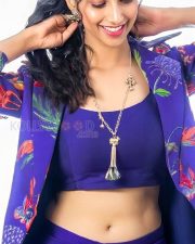 Stunning Meenakshi Chaudhary in a Vibrant Blue Bralette with Matching Skirt and a Stylish Shrug Photos 02