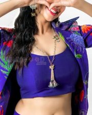 Stunning Meenakshi Chaudhary in a Vibrant Blue Bralette with Matching Skirt and a Stylish Shrug Photos 04