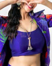 Stunning Meenakshi Chaudhary in a Vibrant Blue Bralette with Matching Skirt and a Stylish Shrug Photos 04