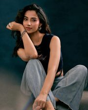 Stylish Actress Meenakshi Chaudhary in a black tank top and jeans Photos 04