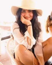 Sunny Actress Kayadu Lohar in a White Sheer Ruffle Blouse and Straw Hat Photos 04