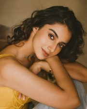 Winsome Actress Meenaakshi Chaudhary in a Yellow Lace Up Crop Top and Jeans Photos 03