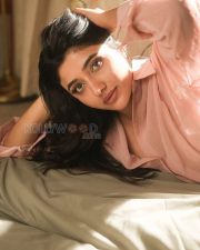 Winsome Actress Mirnaa Menon in a Pink Oversized Shirt Dress Photos 01