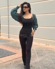 Stylish Ashu Reddy in a Skin Tight Black Dress Photos 02