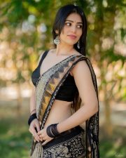Telugu Actress and Model Bandhavi Sridhar in a Black and Gold Printed Saree with a Black Sleeveless Blouse Photos 02