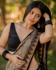 Telugu Actress and Model Bandhavi Sridhar in a Black and Gold Printed Saree with a Black Sleeveless Blouse Photos 05