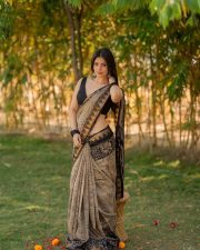 Telugu Actress and Model Bandhavi Sridhar in a Black and Gold Printed Saree with a Black Sleeveless Blouse Photos 06