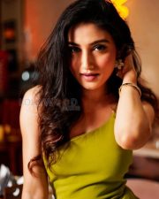 Glamorous Actress Donal Bisht in a Olive Green Feathered Mini Dress Photos 01