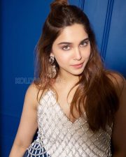 Breezy Actress Sharvari Wagh in a White Crochet Mesh Top and Denim Mini Skirt Photos 02