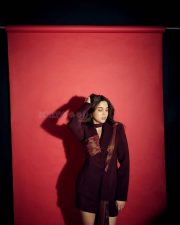 Enigmatic Actress Sharvari Wagh in a Burgundy Satin Blazer and Skirt Photos 01