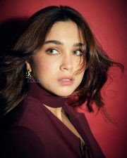 Magnetic Actress Sharvari Wagh in a Dark Burgundy Blazer with Choker Neckline Photos 01