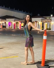 Sexy Tejasswi Prakash in a Shiny Halter Neck Dress Vacation Photos 03