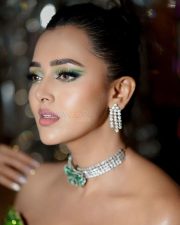 Stunning Bold Tejasswi Prakash in a Green Thigh Slit Off Shoulder Dress Photos 04