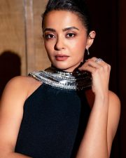 Andhera Actress Surveen Chawla in a Black Sleeveless Halter Neck Gown Photos 02