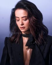 Best Dressed Beauty Surveen Chawla in a Black Blazer with a Plunging V Neckline with a Sheer Black Scarf Photos 03