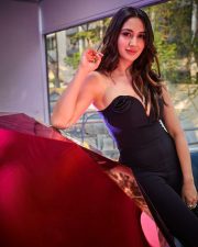 Hot Nikita Dutta in a Black Strapless Black Deep Neck Bodycon Dress Photos 02