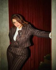 Stylish Ayesha Khan in a Brown Pinstripe Suit with a Blazer Trousers and a White Shirt with a Tie Photos 04
