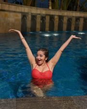 Alluring Asli Monalisa in a Red One Piece Halterneck Swimsuit Photos 04