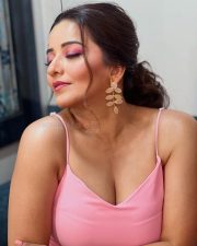 Bhojpuri Actress Asli Monalisa in a Pink Deep Neck Bodycon Dress Photos 01