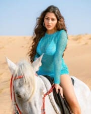 Erotic Symrann K Riding a Horse in a Knitted Swimsuit Photos 04