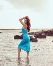 Gangi Gangi Actress Anaira Gupta in a Turquoise Blue Satin Midi Slip Dress with Thin Spaghetti Straps Photos 04